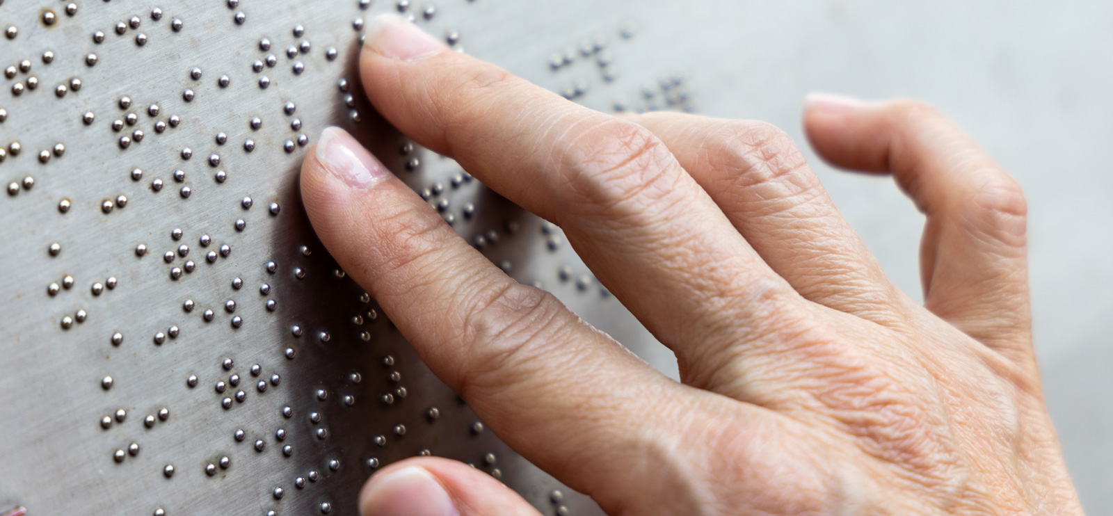 Braille sample being used for a street sign.